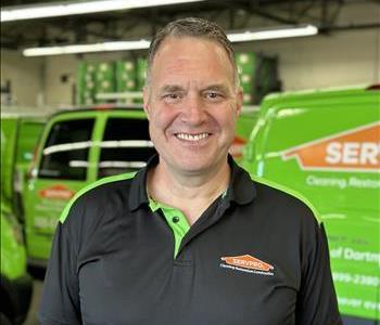 Male standing in front of SERVPRO equipment