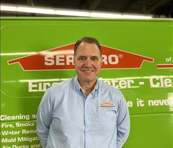 Male standing in front of SERVPRO equipment