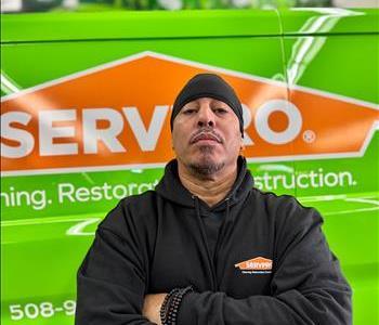 Production Tech Raul Santos poses in front of our work van and air movers